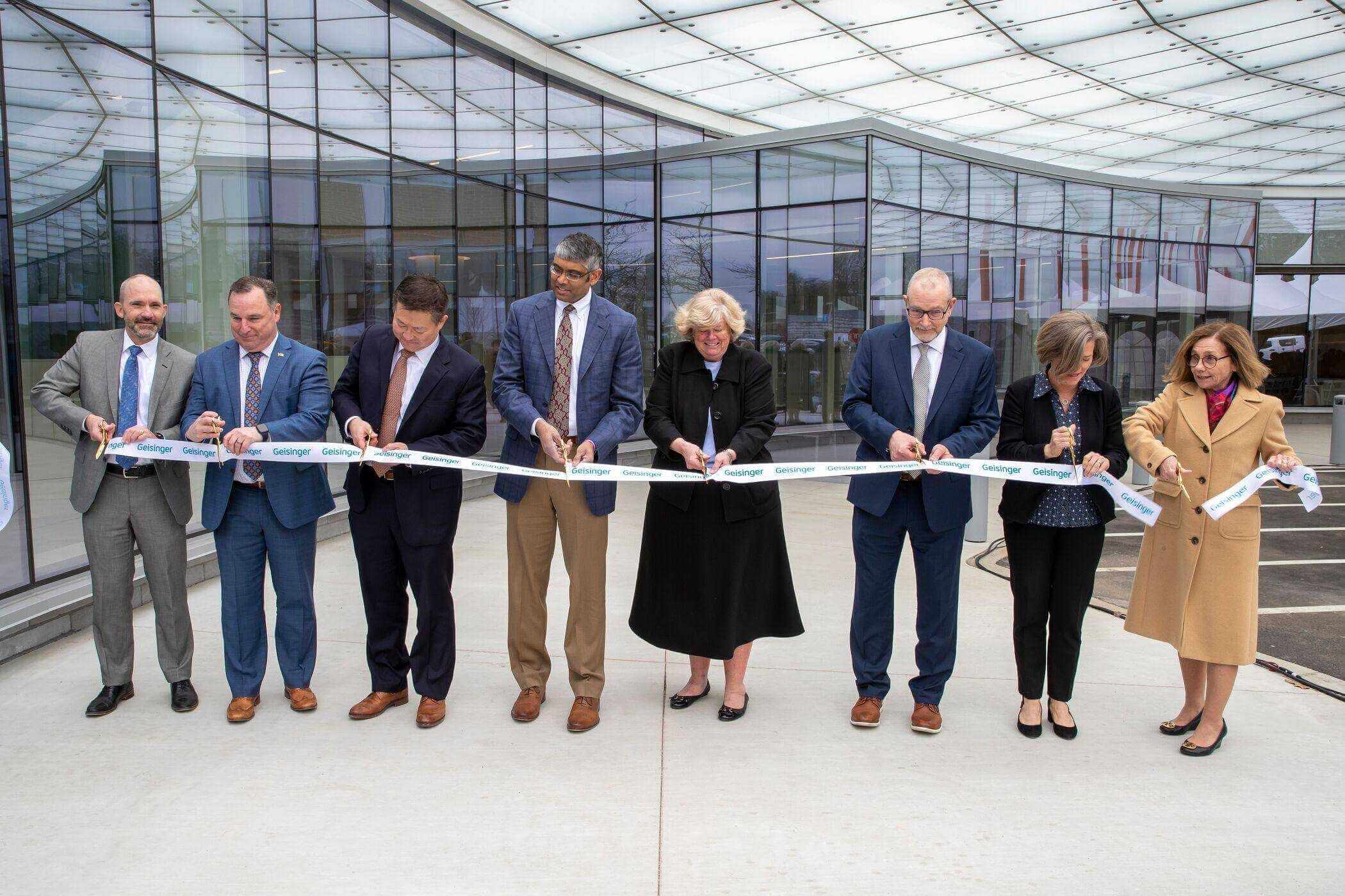 From left, Geisinger Executive Vice President and Chief Operating Officer Matt Walsh, Geisinger Northeast Chief Administrative Officer Ron Beer, Geisinger President and Chief Executive Officer Jaewon Ryu, MD, JD, Geisinger Cancer Institute Chair Rajiv Panikkar, MD, Henry family representative Marjorie Marquart, Geisinger Northeast Radiology Director Mike Blazaskie, Geisinger Executive Vice President and Chief Academic Officer, Julie Byerley, MD, MPH, and Geisinger Health Board of Directors Vice Chair Heather M. Acker cut the ribbon on the newly expanded Frank M. and Dorothea Henry Cancer Center at Geisinger Wyoming Valley Medical Center in Wilkes-Barre.