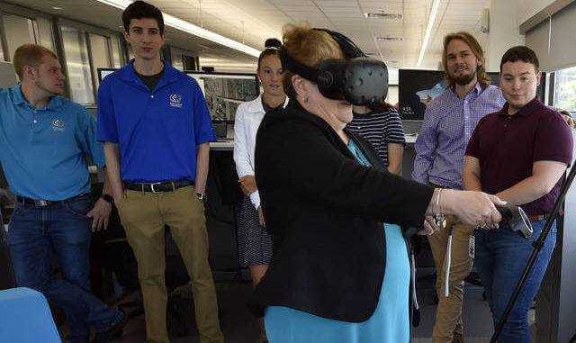 Eileen Cipriani from the Department of Labor and Industry tries out a virtual reality device while meeting with local interns at Borton and Lawson to highlight the State/Local Internship program for young adults last summer. - Aimee Dilger | Times Leader