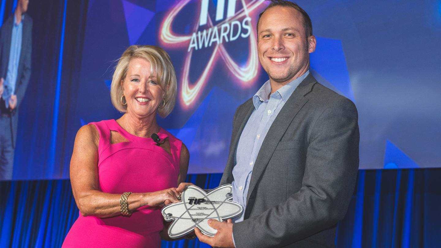 Russel Karshick, Senior Technology Specialist at Susquehanna Steam Electric Station accepts the Stations' TIP Award from NEI's Susan Perkins